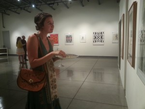 Senior Lili Fischer looks at a piece titled Captive by Keith Achepohl. The exhibit "To Be Human" opened Wednesday night in the University Gallery in Ingram Hall.  Photo by Leah Traxel.  