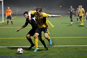 Center back Jeff Piaquadio tries to steal the ball from a Hardin-Simmons attacker on Sept. 14.