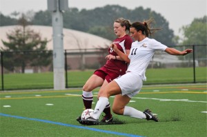 Kaylie Rozell slides into a Puget Sound player during their game on Sept. 14.