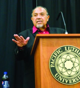 Leno Rose-Avila, a member of the board of directors for Amnesty International, addresses students at the lecture "Immigration Near and Far" on Tuesday evening.