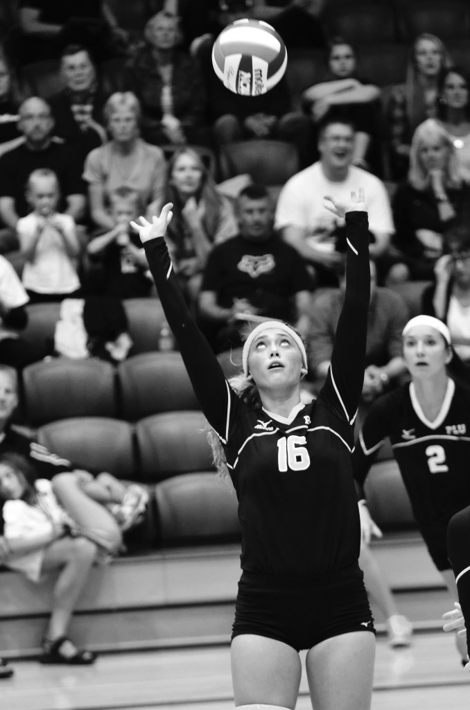 Junior Samantha North sets the ball up for a kill against Linfield. Photo by Jesse Major.
