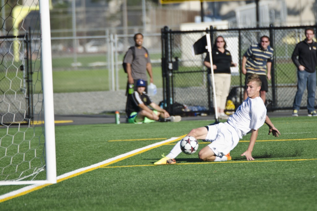 Derek Johnson safely taps in his second goal of the game against Whitman on Sunday.