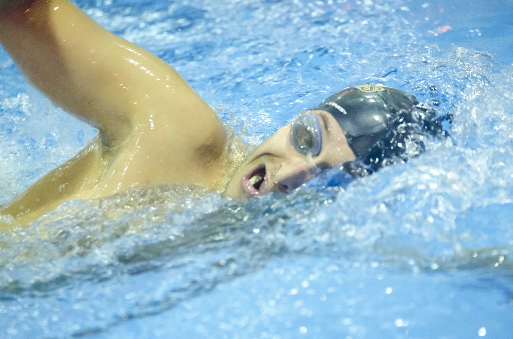 Ramy Carter, a junior, swims the freestyle. Photo by Jesse Major.