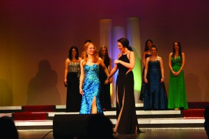 Miss Pierce County contestants Anikka Abbott (left foreground) and Megan Leibold (right foreground) step forward to hear the results of the pageant. Abbott, a junior at Pacific Lutheran University, placed second, while class of 2013 alum Leibold placed first.