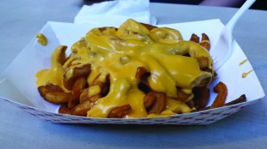 For fair attendees less concerned about being heart-healthy and just looking to indulge, curly fries covered in nacho cheese are a tasty treat. Photo by Leah Traxel.