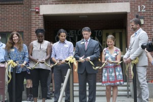Left to Right: Vice President of Student Life and Dean of Students Joanna Royce-Davis, Resident Director Mercy Daramola, Resident Assistant Tyler Dobies, President Thomas Krise, Resident Hall Council President Mollie Parce and Dean of Campus Life and Executive Director of Residential Life Tom Huelsbeck  participate in cutting of the ribbon to freshly renovated Stuen Hall. 