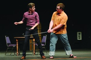 First-years Jake Eliot and Dane Ostile-Olson engage in a golfing lesson in "The Boys Next Door" rehearsal.