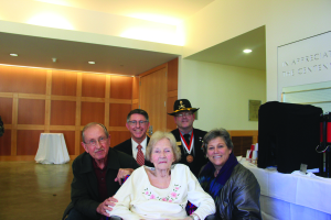 Annie Dodge, who joined the WAV (Women Accepted for Volunteer) in September 1942, with her son Don Warren Dodge (left) and volunteer Patty Gaspar (right). Behind them is President Thomas Krise (left) and Michael Farnum, Director of Military Outreach. Photo Courtesy of Genny Boots