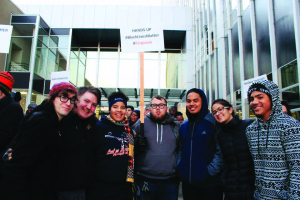 PLU students who attended the protest (left to right): Angela Tinker (junior), Dan Stell (senior), and first-years Quenessa Long, Tono Sablan and Ray Taula. Two students from Stadium High School joined the photo as well. Photo by Angie Tinker