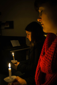 First-years Kaylee Fiedler and Kara Barkman stand holding their candles