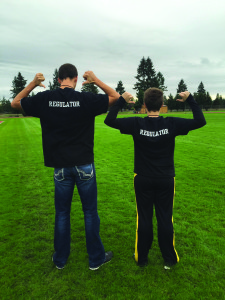 PHOTO BY EMILY MCCONNELL : Senior Christian McConnell (left) and Junior Stephanie Compton (right) display the back of Intramural Referee shirts.