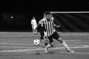 Junior Diego Aceves attempts to make his move around the defender, he was fourth in the league with six assists.