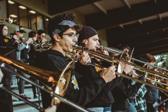 The PLU Pep Band plays at a football game.