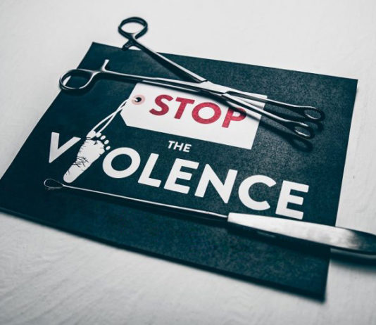 Know your ‘rights’ Paper sign with the text "Stop the Violence." Opinion article.