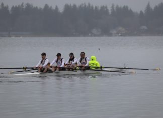 Rowers push their bodies to max to spring across the finish line on American Lake